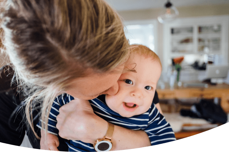 Mother hugging her laughing child